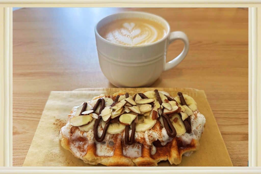 churro croffle and lattee with flower coffee art from Sweet Talk Cafe, Apex, Best Cafes in Raleigh