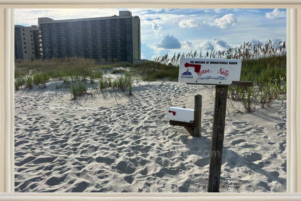 the mailboxes of Wrightsville Beach with Shell Island Resort behind them. 
Shell Island Resort Wrightville Beach NC