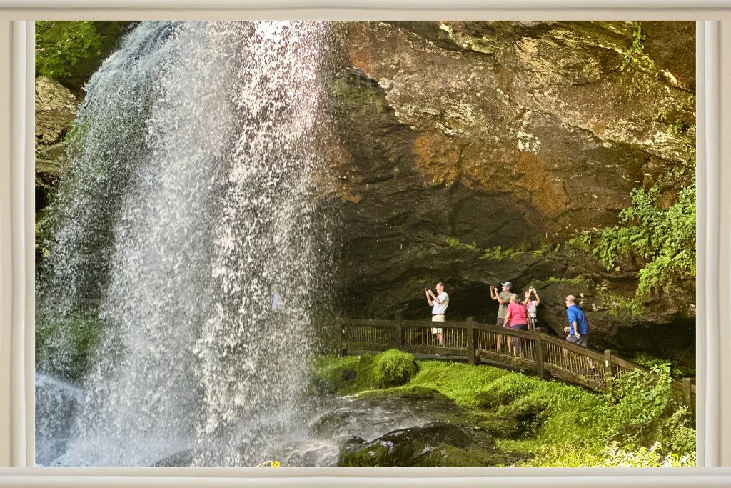 Dry falls, a waterfall with people walking behind it. 
